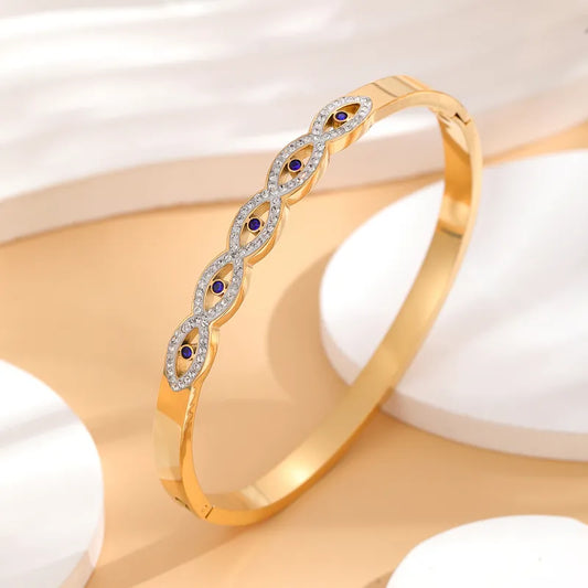 ANNA || Evil Eye 18k Gold Bangle with Cubic Zirconia Eye Braid Design
