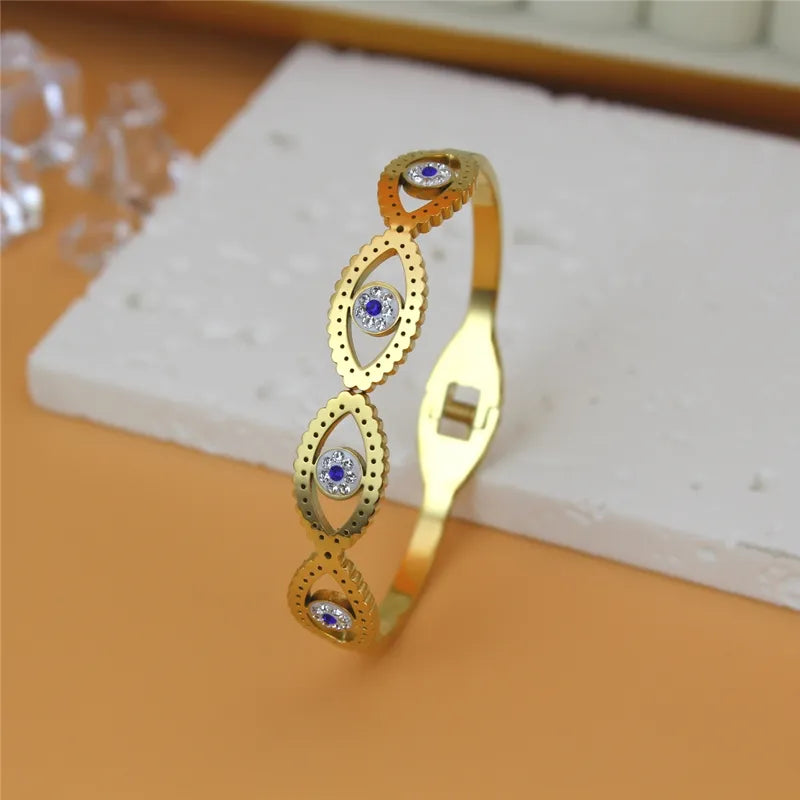 IRIS || Evil Eye 18k Gold Bangle with Large Eye Design Cutouts